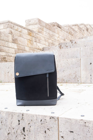 elegant black and grey backpack made of leather and canvas